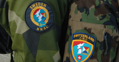 Uniform patches worn by Neutral Nations Supervisory Commission (NNSC) delegates from Sweden and Switzerland. Photo Credit: MC1 Lou Rosales, Wikipedia Commons