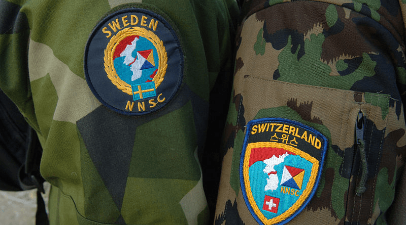 Uniform patches worn by Neutral Nations Supervisory Commission (NNSC) delegates from Sweden and Switzerland. Photo Credit: MC1 Lou Rosales, Wikipedia Commons