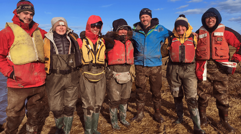 Baranes (second from right) and Woodruff (third from right) on the salt marsh with their team during spring break. CREDIT: UMass Amherst