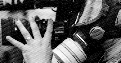 press media journalism camera gas mask war