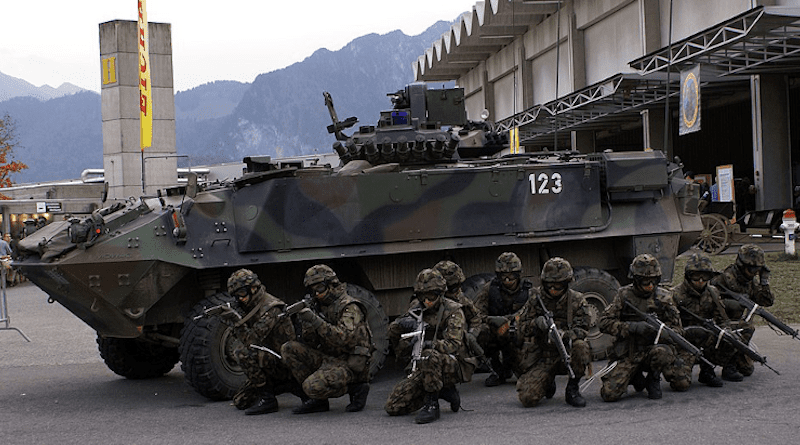 Swiss infantry squad and Mowag Piranha during presentation. Photo Credit: TheBernFiles, Wikimedia Commons