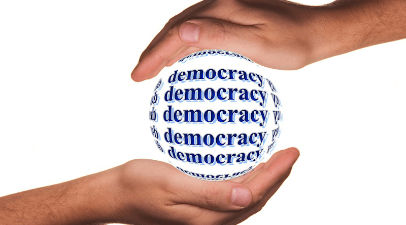 democracy hands globe