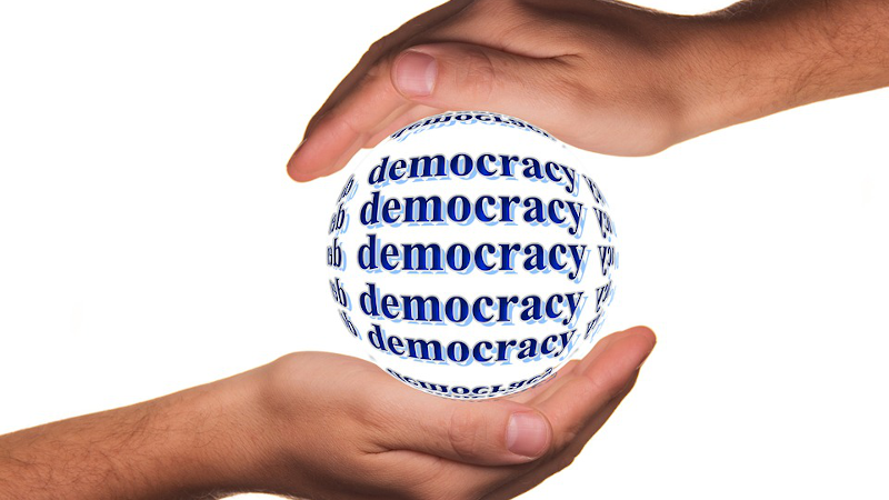 democracy hands globe