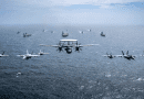 Ships and aircraft from U.S. Navy, Royal Navy, Japan Maritime Self-Defense Force, and Royal Australian Navy, led by USS Carl Vinson, HMS Queen Elizabeth, and JS Kaga, transit in formation during Maritime Partnership Exercise 2021, October 17, 2021, in Bay of Bengal (U.S. Navy/Haydn N. Smith)