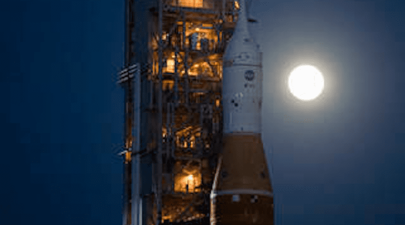 The Moon is seen rising behind NASA's Space Launch System (SLS) rocket with the Orion spacecraft aboard atop a mobile launcher as it rolls out to Launch Complex 39B for the first time, Thursday, March 17, 2022, at NASA's Kennedy Space Center in Florida. Ahead of NASA's Artemis I flight test, the fully stacked and integrated SLS rocket and Orion spacecraft will undergo a wet dress rehearsal at Launch Complex 39B to verify systems and practice countdown procedures for the first launch. Credits: NASA