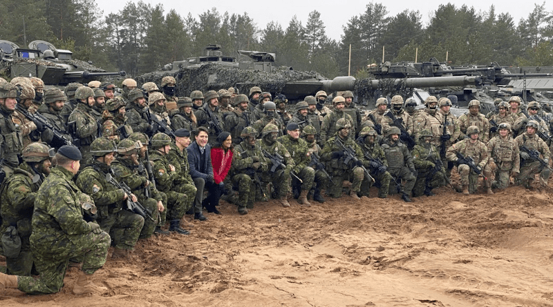 Canadian Prime Minister Justin Trudeau and Canadian Minister of National Defense Anita Anand pose for pictures with NATO forces March 8, 2022 in Adazi, Latvia. Photo Credit: Army Staff Sgt. Matthew Brown