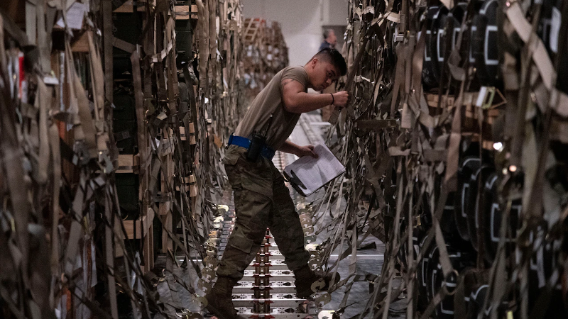 Senior Airman Jansen Esteves, a 436th Aerial Port Squadron special handler, verifies shipment information for supplies bound for Ukraine at Dover Air Force Base, Del. Photo Credit: DoD