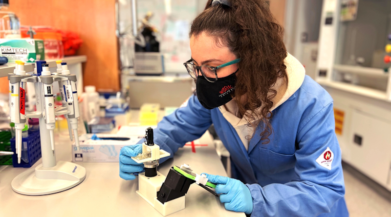 Emory University graduate student Selma Piranej, first author of the study, shown in the lab with a cell phone microscope set up to observe the rolling DNA-based motors. CREDIT: Salaita Lab, Emory University