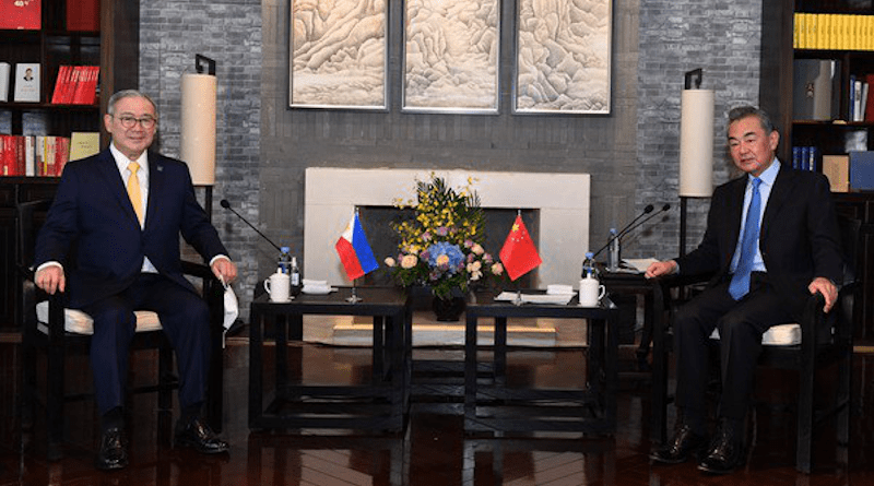 Filipino Foreign Secretary Teodoro Locsin Jr. (left) sits across from Chinese Foreign Minister Wang Yi during a meeting in the district of Tunxi in Anhui province, China, April 3, 2022. [Photo courtesy Ministry of Foreign Affairs of the People’s Republic of China]