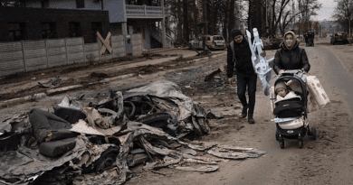 Ukrainian family flees in aftermath of Russia bombing. Photo Credit: Ukraine Ministry of Defense