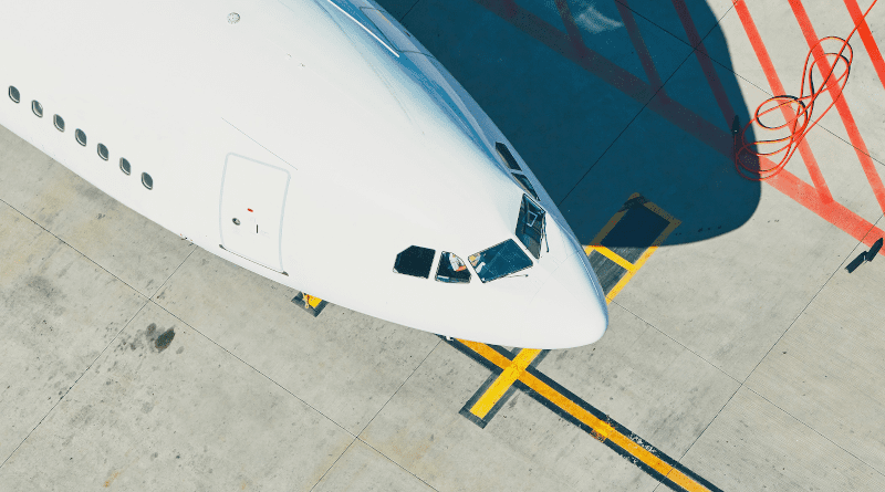 An airplane in an airport. Photo Credit: Indra