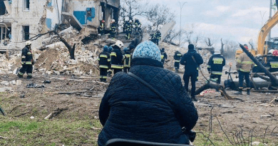 A woman waits for her family to be unearthed from under the rubble in Borodyanka after Russia attacks. Photo Credit: Ukraine Ministry of Defense.