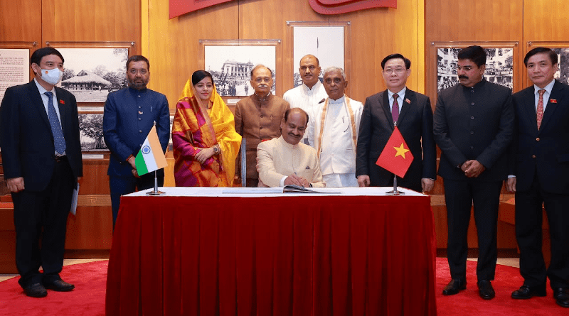 India's Lok Sabha (Lower House of Indian Parliament) Speaker Shri Om Birla signing the Visitors' Book at the National Assembly of Vietnam. Photo Credit: Lok Sabha Secretariat, Facebook