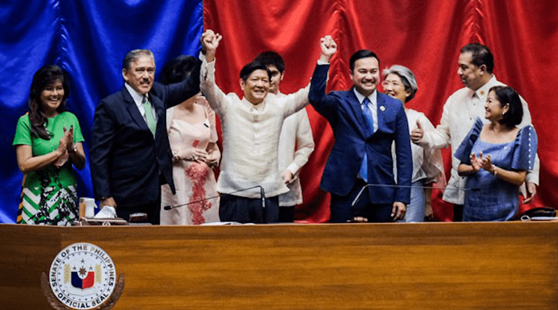 Ferdinand Marcos Jr. has his hands raised by Senate President Vicente Sotto (to his right) and House Speaker Lord Allan Velasco (to his left) as the Philippine Congress proclaims him winner of the May 9 presidential election, May 25, 2022. Photo Credit: BenarNews