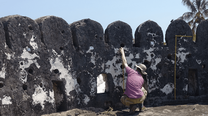 Dr Alessandro Ghidoni records a ship graffito in the southwestern tower of Zanzibar Fort. (Credit: John P Cooper)