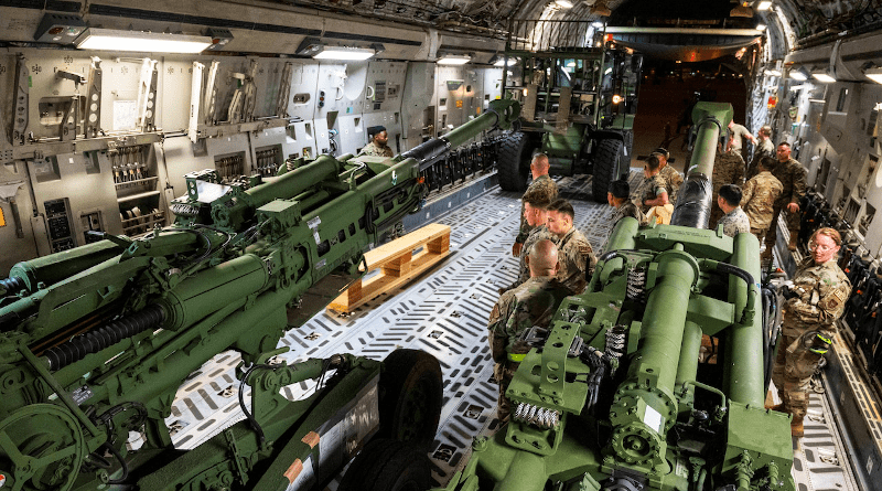 Air Force airmen assigned to the 452nd Air Mobility Wing and Marines assigned to the 1st Marine Expeditionary Force from Camp Pendleton, Calif., load several 155 mm M777 towed howitzers onto a C-17 Globemaster III on March Air Reserve Base, Calif. Photo Credit: Air Force Staff Sgt. Shawn White