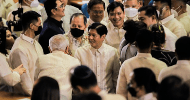 Members of Congress surround President Ferdinand Marcos Jr. moments before his first State of the Nation address at the House of Representatives in Quezon City, Metro Manila, July 25, 2022. FOCAP Pool/Xinhua/BenarNews