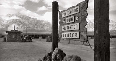 Wooden sign at entrance to the Manzanar War Relocation Center. Photo Credit: Ansel Adams, Wikipedia Commons