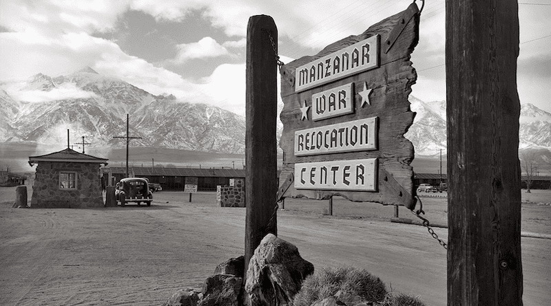 Wooden sign at entrance to the Manzanar War Relocation Center. Photo Credit: Ansel Adams, Wikipedia Commons