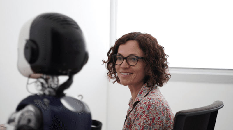 Agnieszka Wykowska, Coordinator of IIT’s “Social Cognition in Human-Robot Interaction” lab in Genova, interacting with the humanoid robot iCub. CREDIT: IIT-Istituto Italiano di Tecnologia