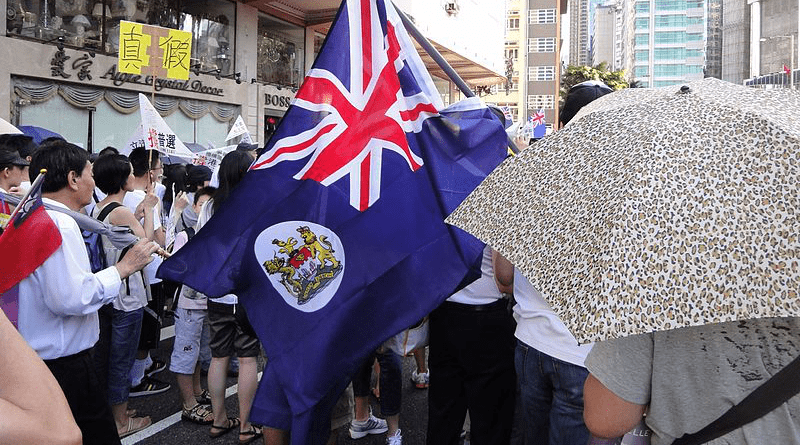 A July 1 March with British Hong Kong Flag in 2011. Photo Credit: Silvermetals, Wikipedia Commons