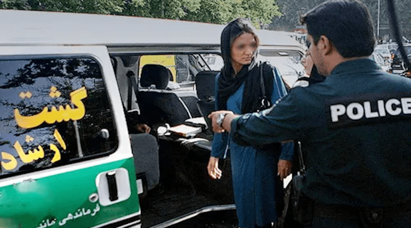 Iranian police stop a woman. Photo Credit: Iran News Wire