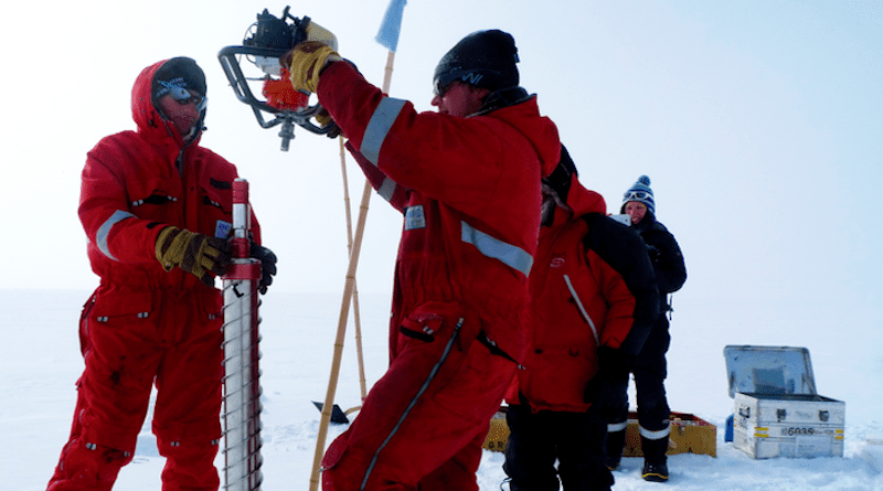 Taking a firn core sample CREDIT: Dr Markus Frey, British Antarctic Survey