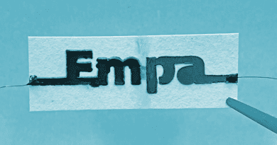 The paper battery is composed of two electrochemical cells – at both ends of the paper strip – separated by a water barrier (between the letters "m" and "p") and connected in series. CREDIT: Empa
