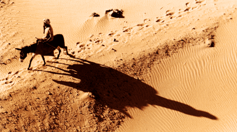 A man crossing the desert in Sudan on a donkey CREDIT: © André Vila