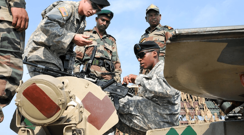 File photo of U.S. and Indian soldiers sharing information about vehicles and weapons systems at the static display after the opening ceremony for a previous Yudh Abhyas joint military exercise. Photo Credit: DOD