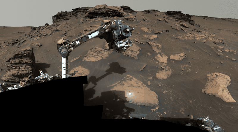 NASA's Perseverance rover puts its robotic arm to work around a rocky outcrop called "Skinner Ridge" in Mars' Jezero Crater. Composed of multiple images, this mosaic shows layered sedimentary rocks in the face of a cliff in the delta, as well as one of the locations where the rover abraded a circular patch to analyze a rock's composition. Credits: NASA/JPL-Caltech/ASU/MSSS