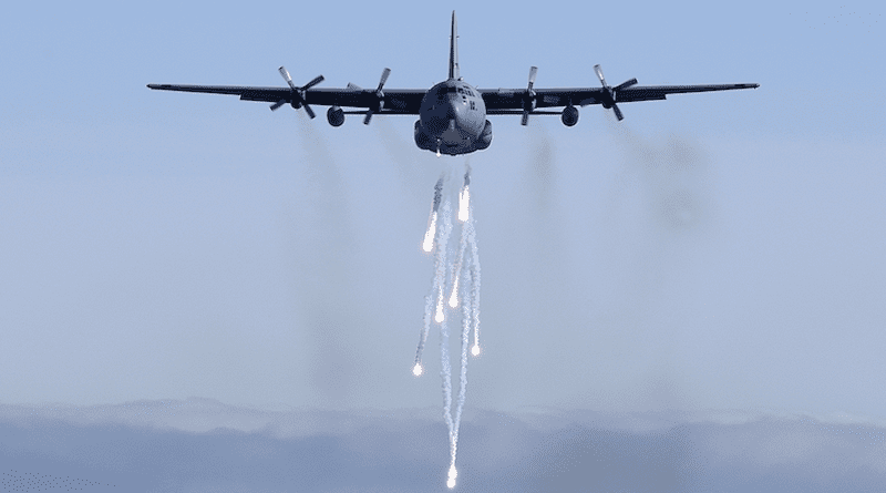 A Michigan Air National Guard C-130E dispatches its flares during a low-level training mission. Photo Credit: Master Sergeant Munnaf Joarder, DoD