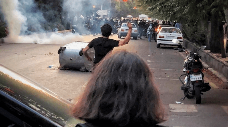 Iranian protest against Mahsa Amini's killing in Tehran's Keshavarz Blvd. Photo Credit: Darafsh, Wikipedia Commons (photo cropped)