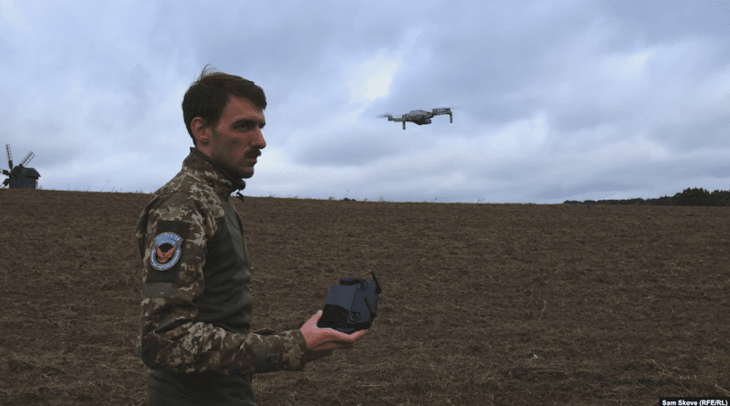 Instructor Ilya Trokhin demonstrates the controls of an unmanned aircraft at the Kruk drone school in Kyiv. Photo Credit: Sam Skove, RFE/RL