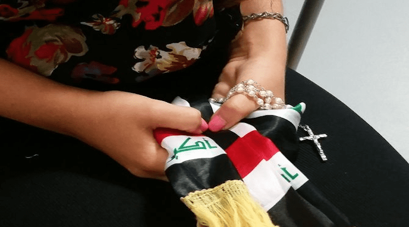 An Iraqi woman holding a rosary. | Elise Harris/CNA.