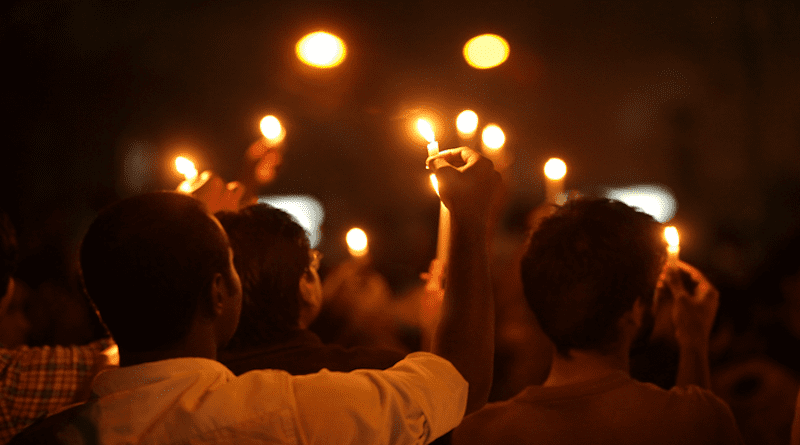 File photo of demonstrators holding candles for a commemoration of the Bangladesh genocide. Photo Credit: Kabir Hossain, Wikipedia Commons