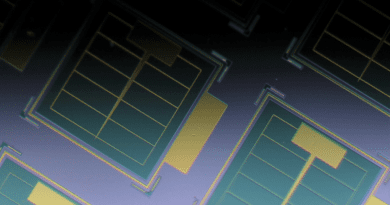 Photo of ultrathin on-chip solar cells. The cells are the green squares and include an ultrathin layer of light-absorbing GaAs, which is key to their radiation tolerance. The surface of each green square is only 120 nanometers, about one-thousandth the thickness of a human hair, above the surrounding gray area. The gold-colored grids are electrically conducting metal contacts. CREDIT: Armin Barthel