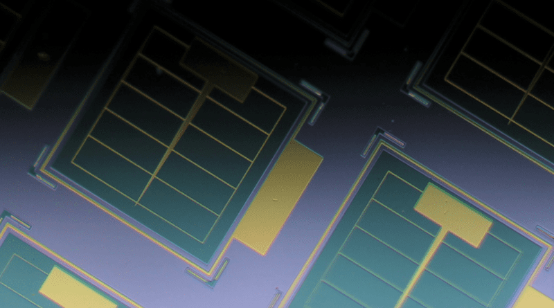 Photo of ultrathin on-chip solar cells. The cells are the green squares and include an ultrathin layer of light-absorbing GaAs, which is key to their radiation tolerance. The surface of each green square is only 120 nanometers, about one-thousandth the thickness of a human hair, above the surrounding gray area. The gold-colored grids are electrically conducting metal contacts. CREDIT: Armin Barthel