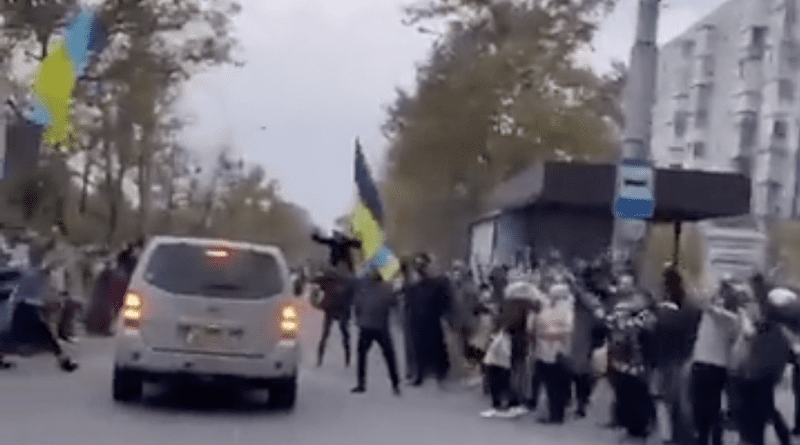 Ukrainians celebrate withdrawal of Russian troops. Photo Credit: Ukraine Defense Ministry video screenshot