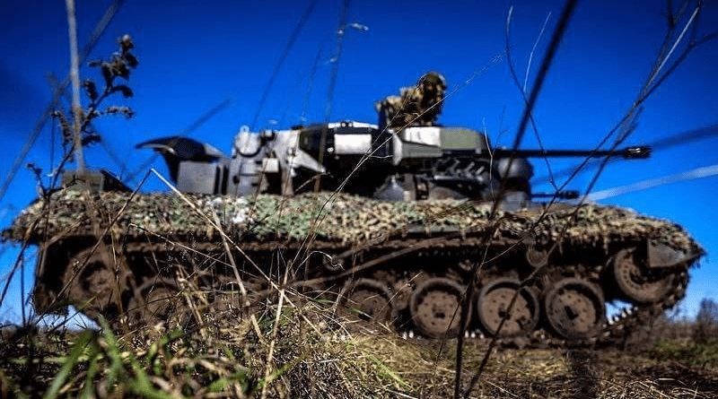 Ukrainian soldier and tank. Photo Credit: Ukraine Defense Ministry