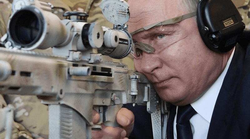 File photo of Russian President Vladimir Putin shooting a Chukavin sniper rifle (SVCh 380) at Kalashnikov Concern shooting club at the military patriotic park Patriot in Kubinka, near Moscow, Russia. Photo Credit: Kremlin.ru
