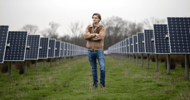 Wilson Ricks, the study's first author, stands at the solar array at Princeton University. CREDIT: Bumper DeJesus