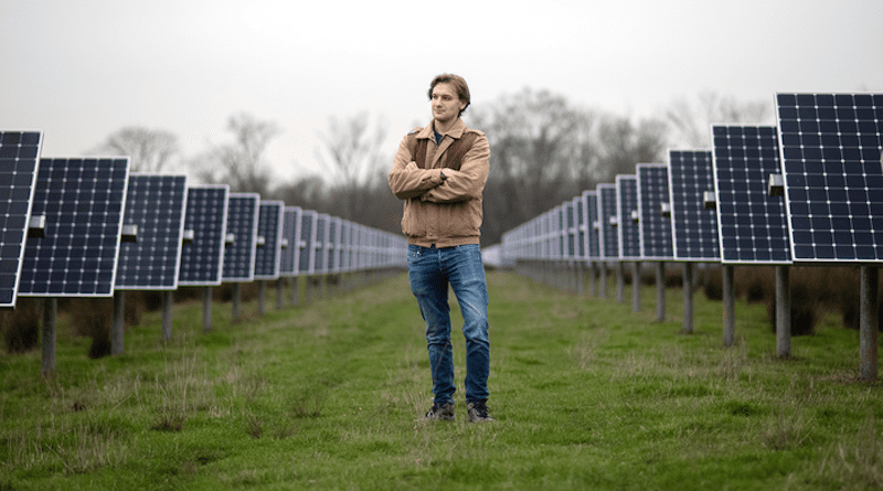 Wilson Ricks, the study's first author, stands at the solar array at Princeton University. CREDIT: Bumper DeJesus