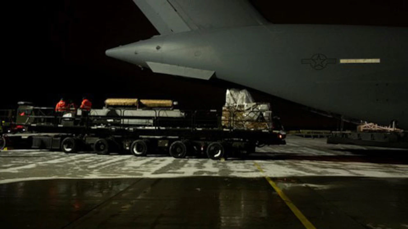 Air Force airmen offload cargo bound for Ukraine at a staging area in Europe, Dec. 14, 2022. Photo Credit: Air Force Staff Sgt. Christian Sullivan
