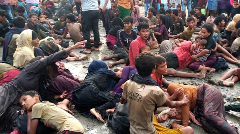 Exhausted Rohingya refugees lie on a beach after arriving by boat in Ujong Pie, a village in the Pidie regency of Indonesia’s Aceh province, Dec. 26, 2022. Photo Credit: Courtesy Malfian