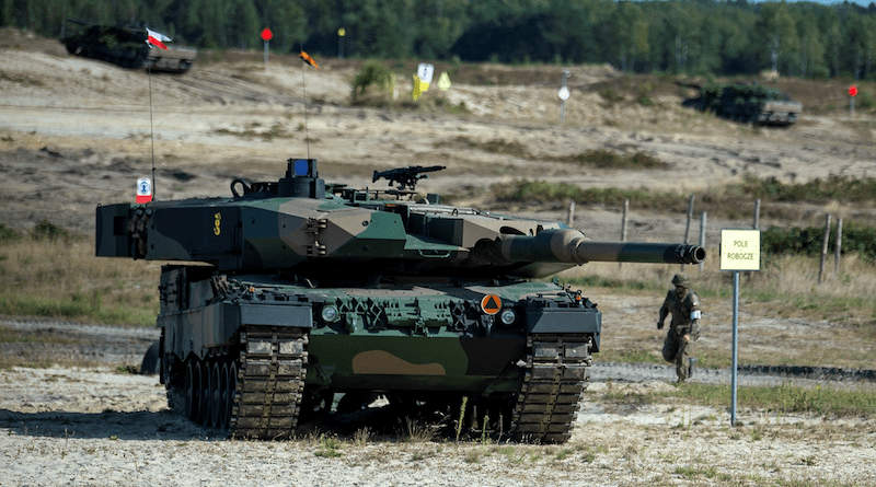 Troops from Poland with a Leopard 2PL tank. Photo Credit: Gov.pl, Wikipedia Commons