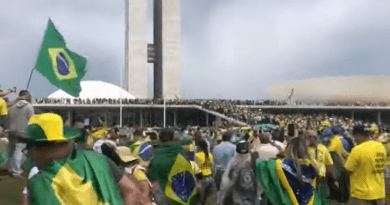 Protesters climbing the ramp of the National Congress of Brazil during the attack on January 8, 2023. Photo Credit: Tour na 44 em Goiânia, Wikipedia Commons