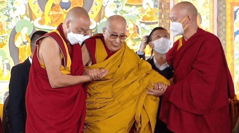 Frail Dalai Lama being supported by two monks. Credit: Kalinga Seneviratne
