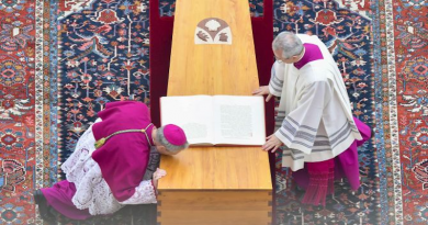 Archbishop Georg Ganswein (left), longtime personal secretary of Pope Benedict XVI, kisses the coffin of friend and mentor at his funeral on Jan. 5, 2023, at the Vatican. | Vatican Media