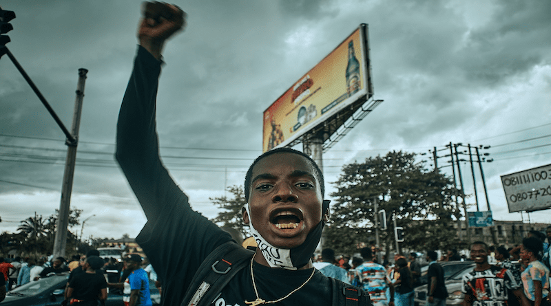 Nigeria people demonstration protest man